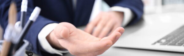 Businessman demanding bribe indoors, closeup
